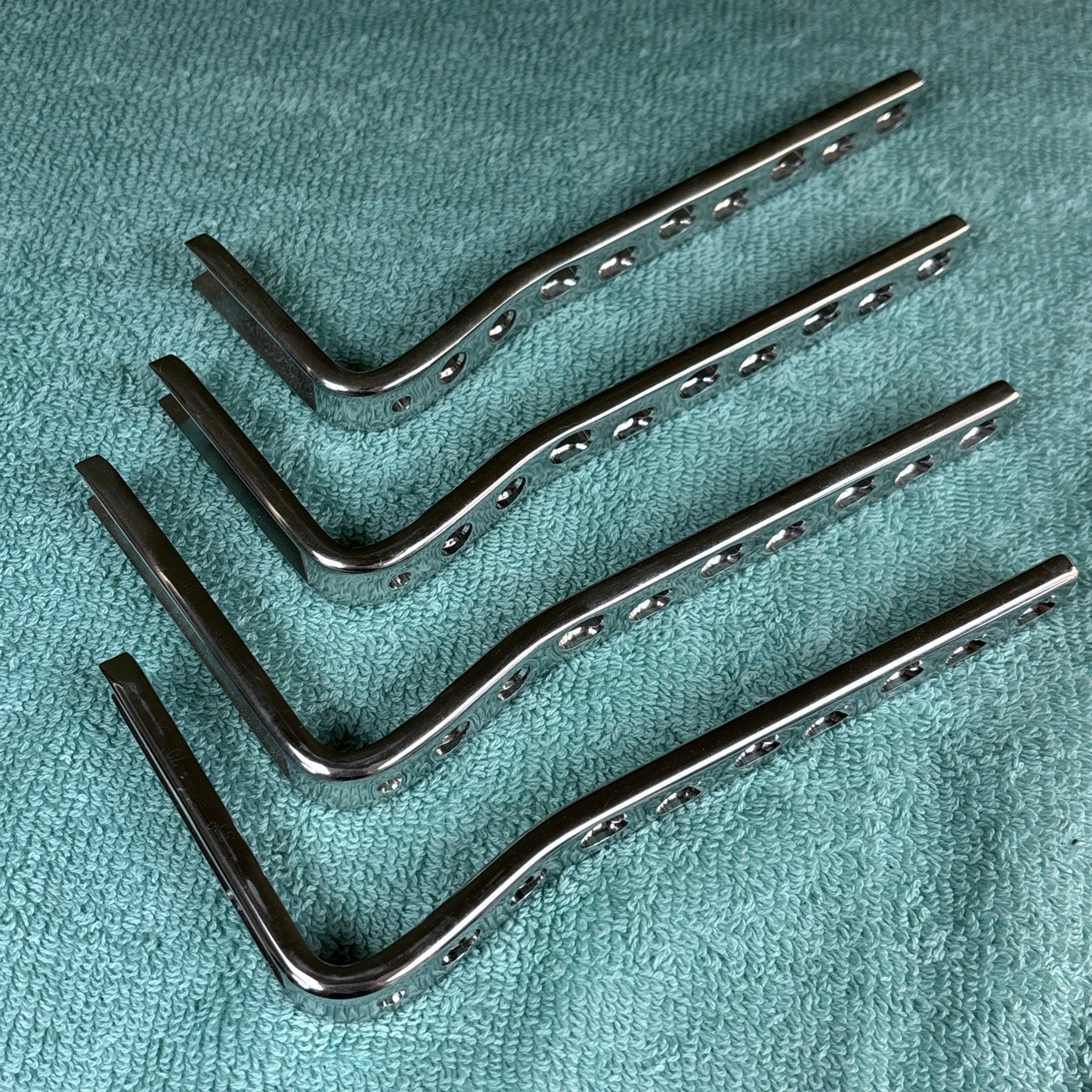 (4) 95° Condylar Angled Blade Plates 50,60,70,80, 9 Holes each 6 1/2\ (4) 95° Condylar Angled Blade Plates 50,60,70,80, 9 Holes each 6 1/2\